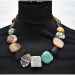 A multi polished stone necklace 57 cm.