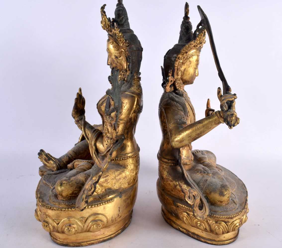 A LARGE PAIR OF 19TH CENTURY CHINESE TIBETAN GILT BRONZE FIGURES OF BUDDHAS Qing, modelled upon - Image 8 of 9