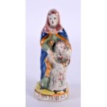 AN ANTIQUE FRENCH FAIENCE TIN GLAZED POTTERY FIGURE OF ST ANNE. 9.5 cm high.