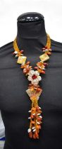 A carved hardstone and multi bead Butterfly necklace 43 cm.