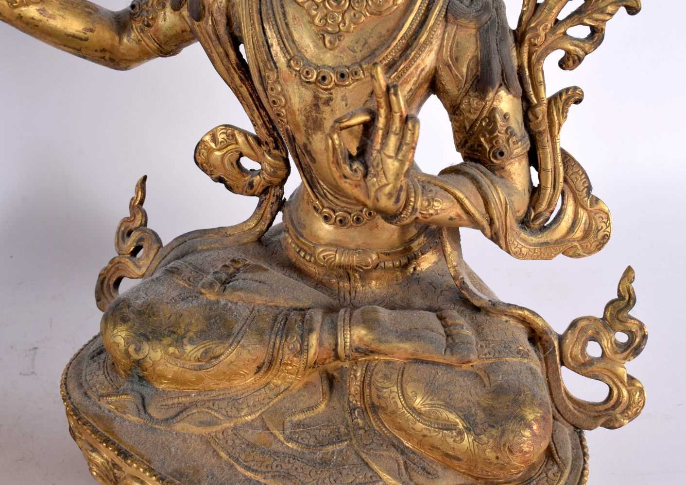 A LARGE PAIR OF 19TH CENTURY CHINESE TIBETAN GILT BRONZE FIGURES OF BUDDHAS Qing, modelled upon - Image 5 of 9