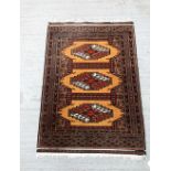 A Turkman rug 94 x 65 cm .