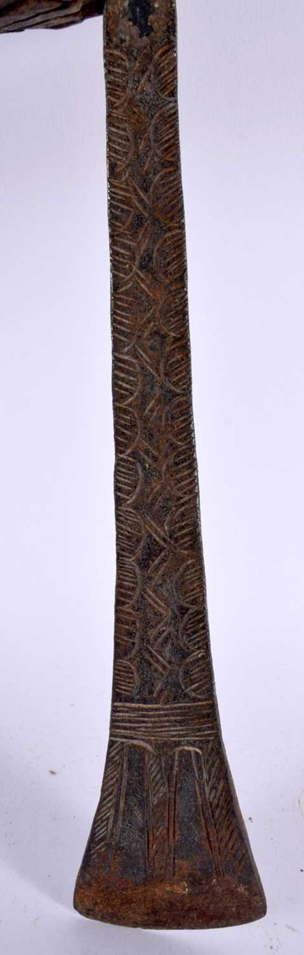 AN AFRICAN TRIBAL CARVED WOOD AND IRON AXE together with two others. Largest 52 cm long. (3) - Image 3 of 13