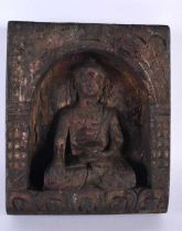A 19TH CENTURY INDIAN TIBETAN NEPALESE CARVED WOOD BUDDHIST SHRINE modelled as a seated buddha. 23