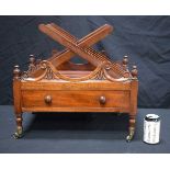 A 19th Century mahogany Canterbury in the manner of Gillows fitted with brass castors 49 x 51 x 35