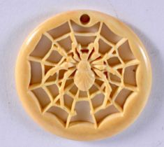 AN ANTIQUE CARVED BONE SPIDER WEB PENDANT. 5 grams. 4.25 cm diameter.