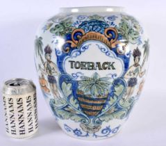 A LARGE DUTCH DELFT MAJOLICA DELFT PORCELAIN TOBACCO JAR painted with figures within exotic