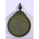 A 19TH CENTURY ISLAMIC MIDDLE EASTERN BRONZE ASTROLABE decorated with calligraphy and scripture.