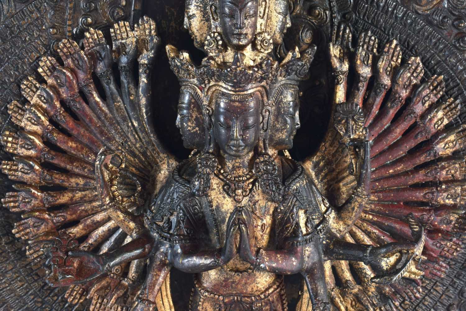 A LARGE CHINESE LACQUERED SINO TIBETAN BRONZE FIGURE OF A BUDDHA modelled with multiple arms. 46 - Image 4 of 10