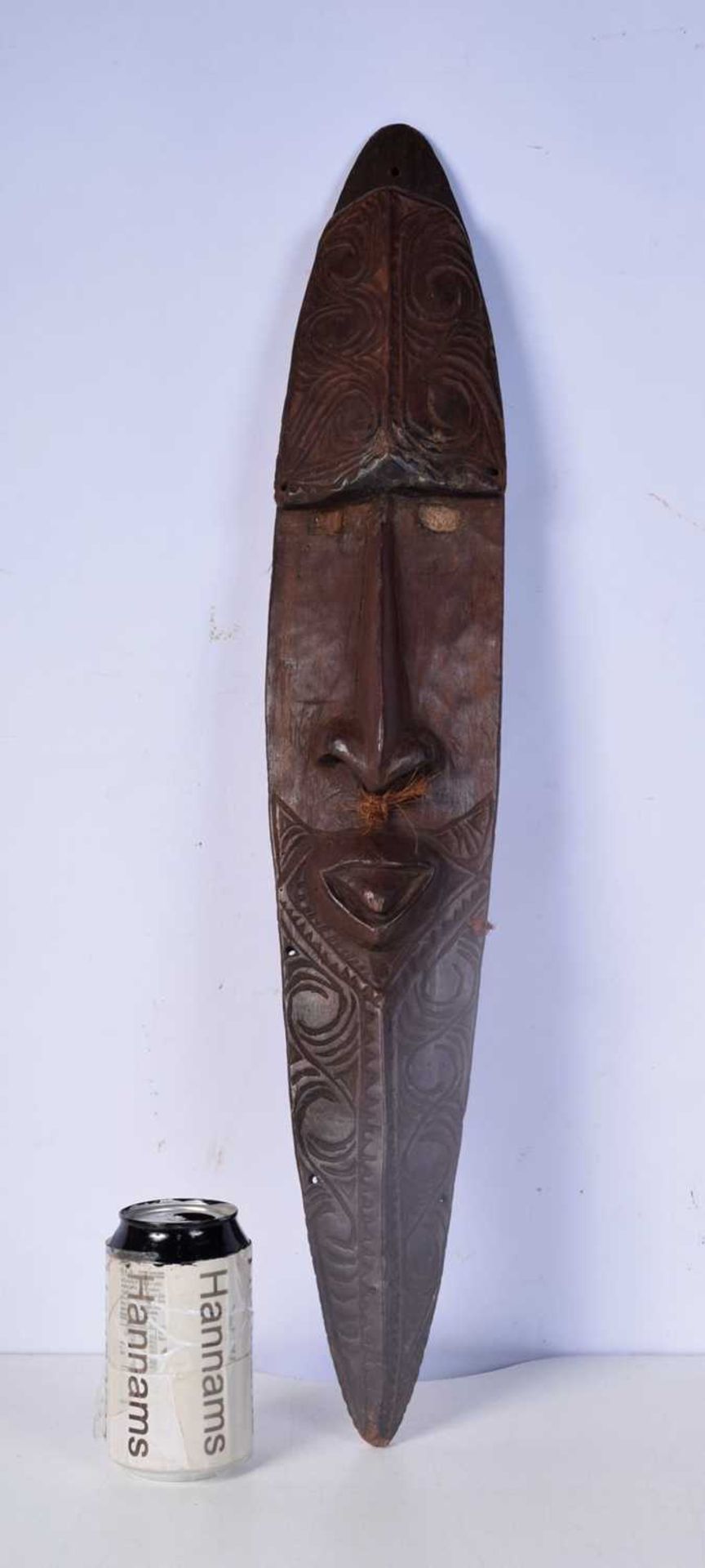 A Carved wood Pacific Island mask 68 cm.