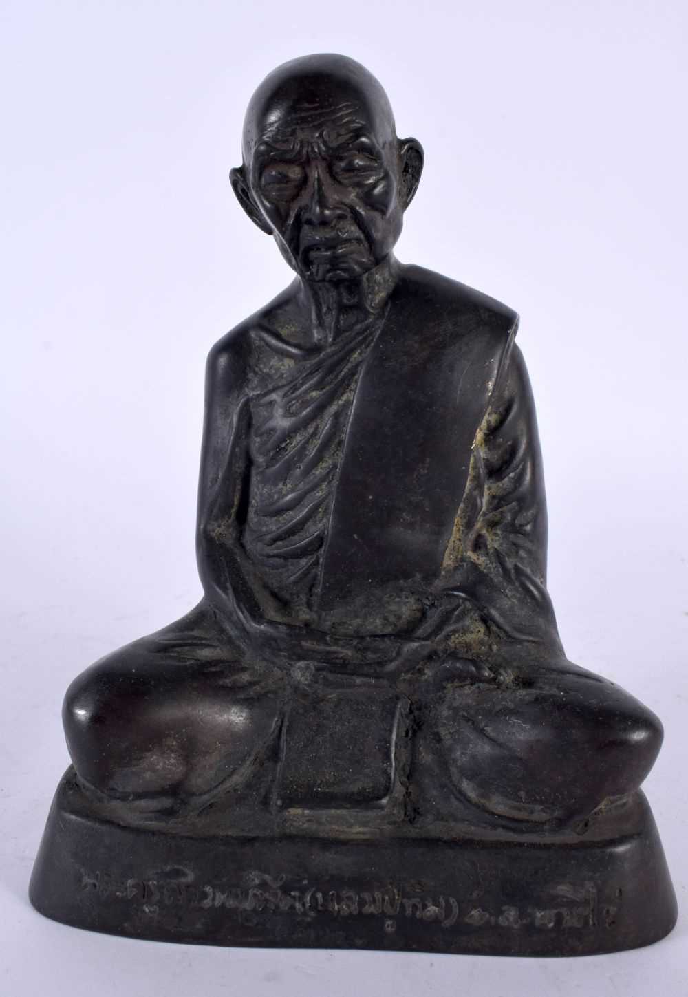 A CHINESE TIBETAN BRONZE FIGURE OF AN ELDERLY BUDDHA 20th Century. 16 cm high.