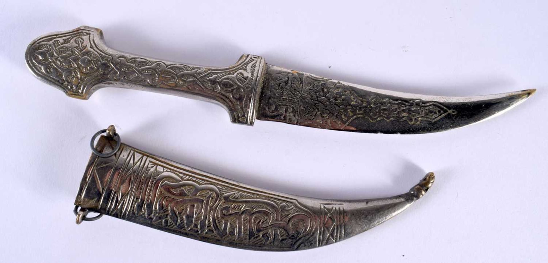 A Middle Eastern Dagger with calligraphic Inscription. 27 cm long.