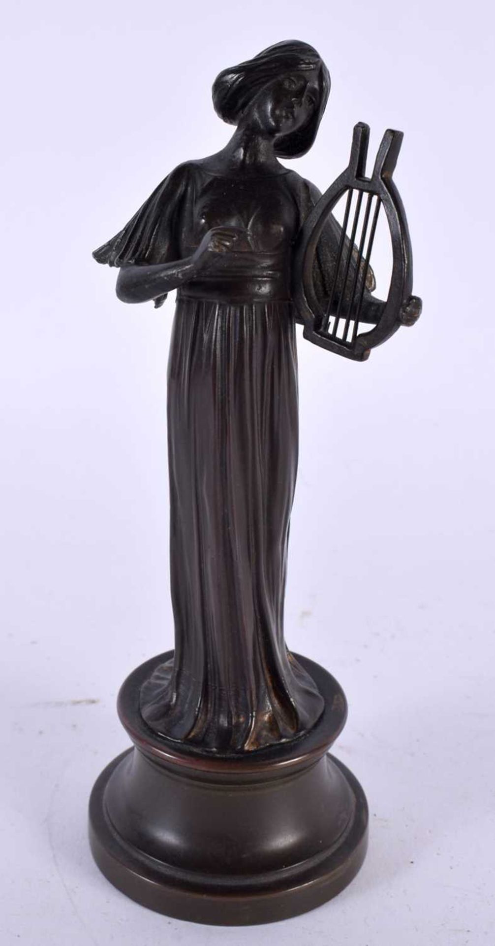 AN ART DECO CONTINENTAL BRONZE FIGURE OF A FEMALE MUSICIAN. 18cm high.