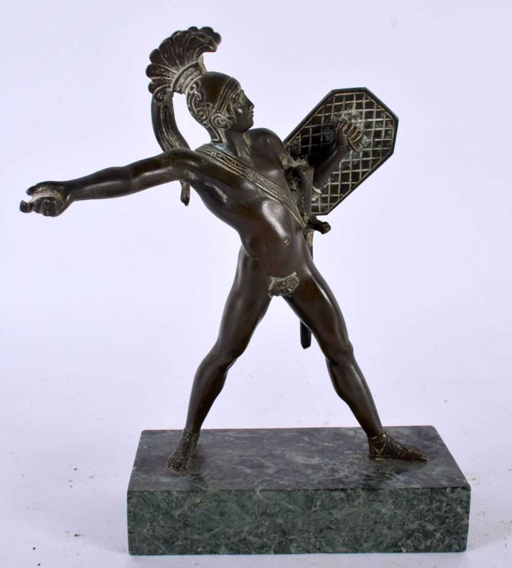 A 19TH CENTURY EUROPEAN GRAND TOUR BRONZE FIGURE OF A GLADIATOR upon a marble base. 18cm x 12 cm.