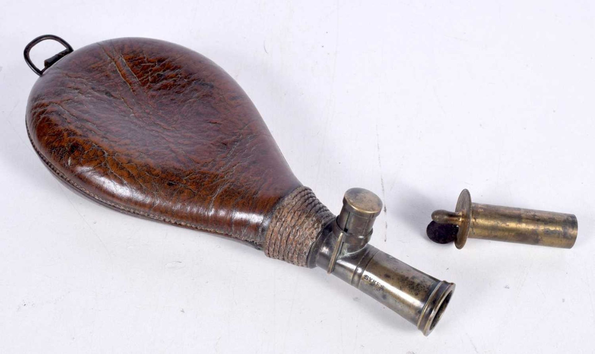 A 19th Century leather and brass powder flask 22cm. - Image 3 of 3