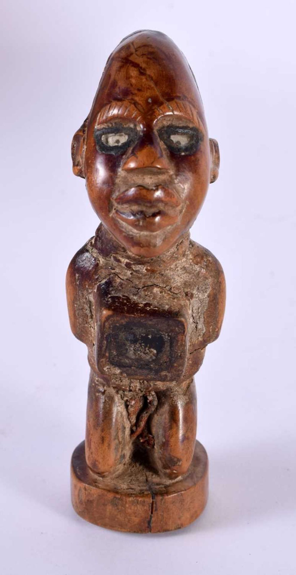 A TRIBAL NKISHI FETISH FIGURE KONGO - 13cm high. This figure has preserved the receptacle of magic