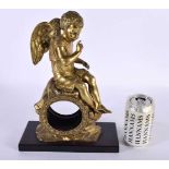 A FINE 19TH CENTURY EUROPEAN ORMOLU CLOCK CASE formed as a winged putti upon a naturalistic outcrop.