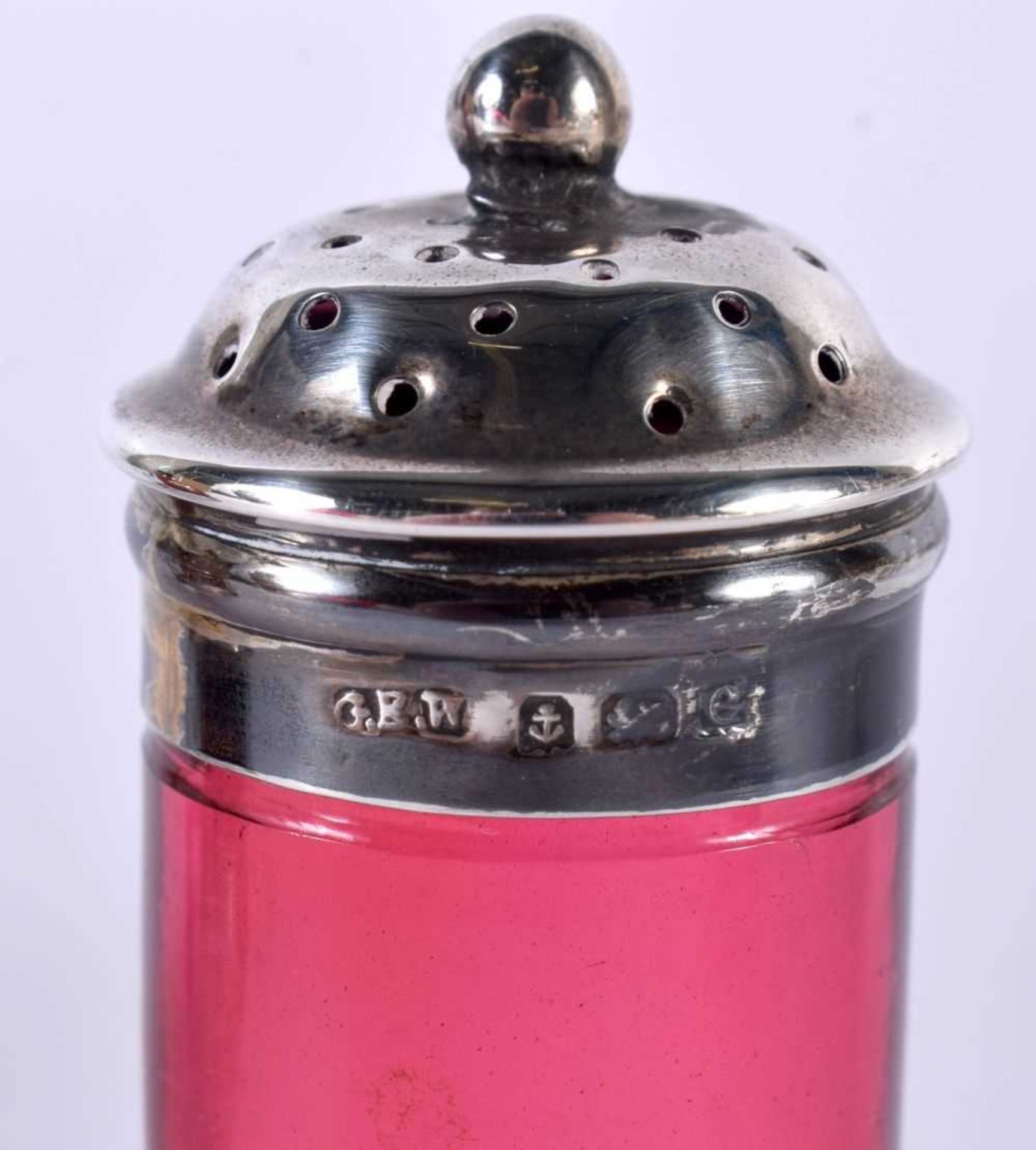 A SILVER AND CRANBERRY GLASS CRUET SET. Hallmarked Birmingham 1902. Overall 10cm x 7.5cm x 6 cm, - Image 3 of 6