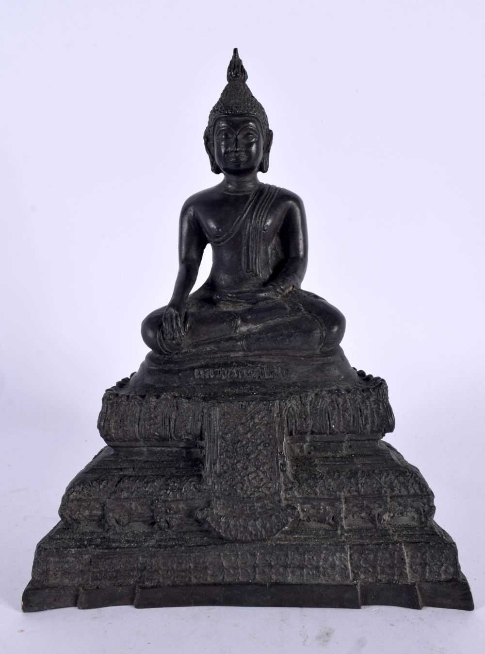 A SOUTH EAST ASIAN THAI BRONZE BUDDHA modelled upon a stepped base. 18cm x 12 cm.