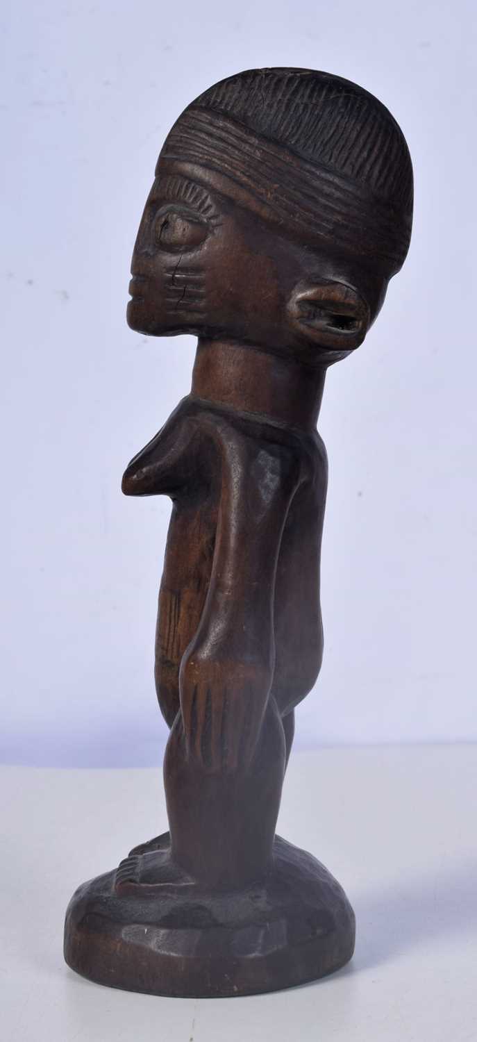 A carved wood Nigerian Yoruba female Ibeji figure 24 cm. - Image 4 of 5
