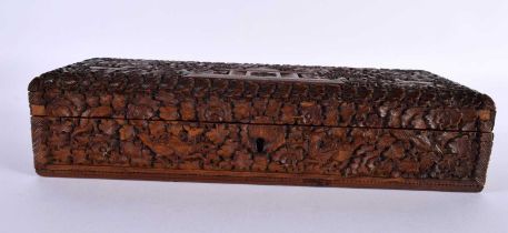 A FINE 19TH CENTURY INDIAN CARVED SANDALWOOD RECTANGULAR CASKET decorated all over with animals in