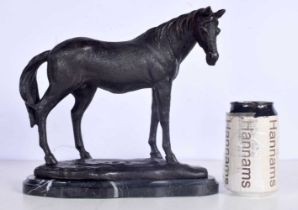 A bronze horse mounted on a marble plinth 23 x 28cm.