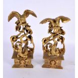 A RARE PAIR OF EARLY 19TH CENTURY EUROPEAN ORMOLU FIGURAL GROUPS depicting vultures overlooking