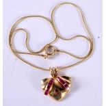 A 14CT GOLD AND RUBY NECKLACE. Stamped 14K, Pendant 2.6 cm, chain 41cm, weight 13g