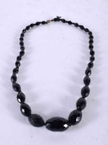 A FACETED BEAD NECKLACE. 34.8 grams. 46 cm long.