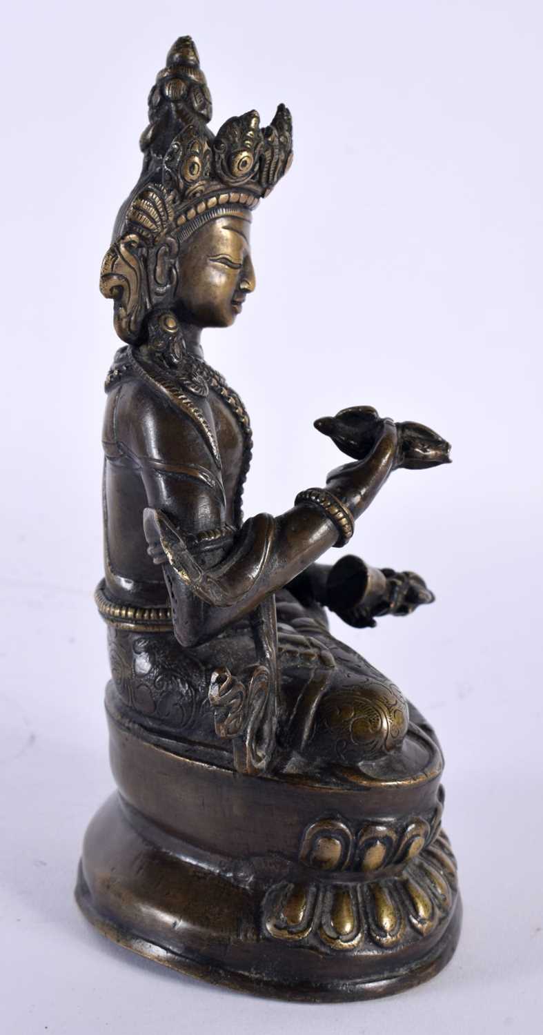 A 19TH CENTURY TIBETAN NEPALESE BRONZE FIGURE OF A SEATED BUDDHA modelled holding buddhistic - Image 3 of 4
