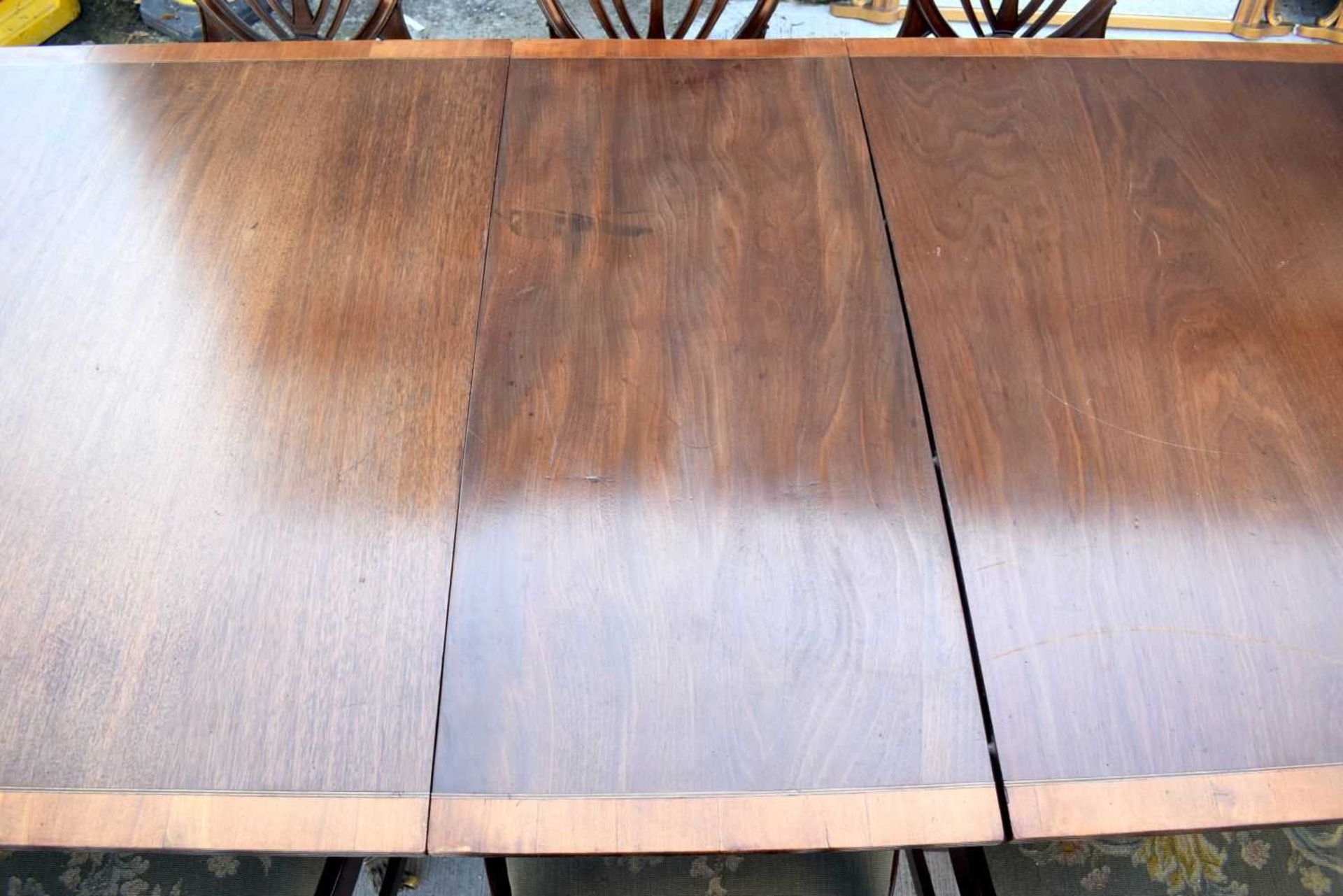 A Mahogany dining table with a veneer edging with 8 mahogany Shield back chairs with upholstered - Image 3 of 12