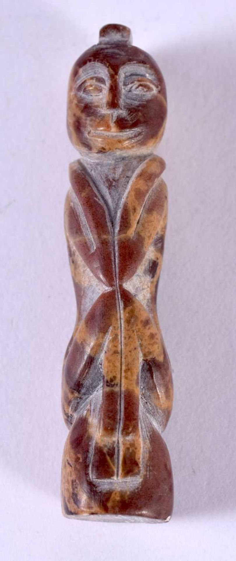 AFRICAN TRIBAL CARVED HARDSTONE PENDANT IN THE FORM OF A SEATED MALE. 5cm x 1.1cm x 1.2 cm, weight