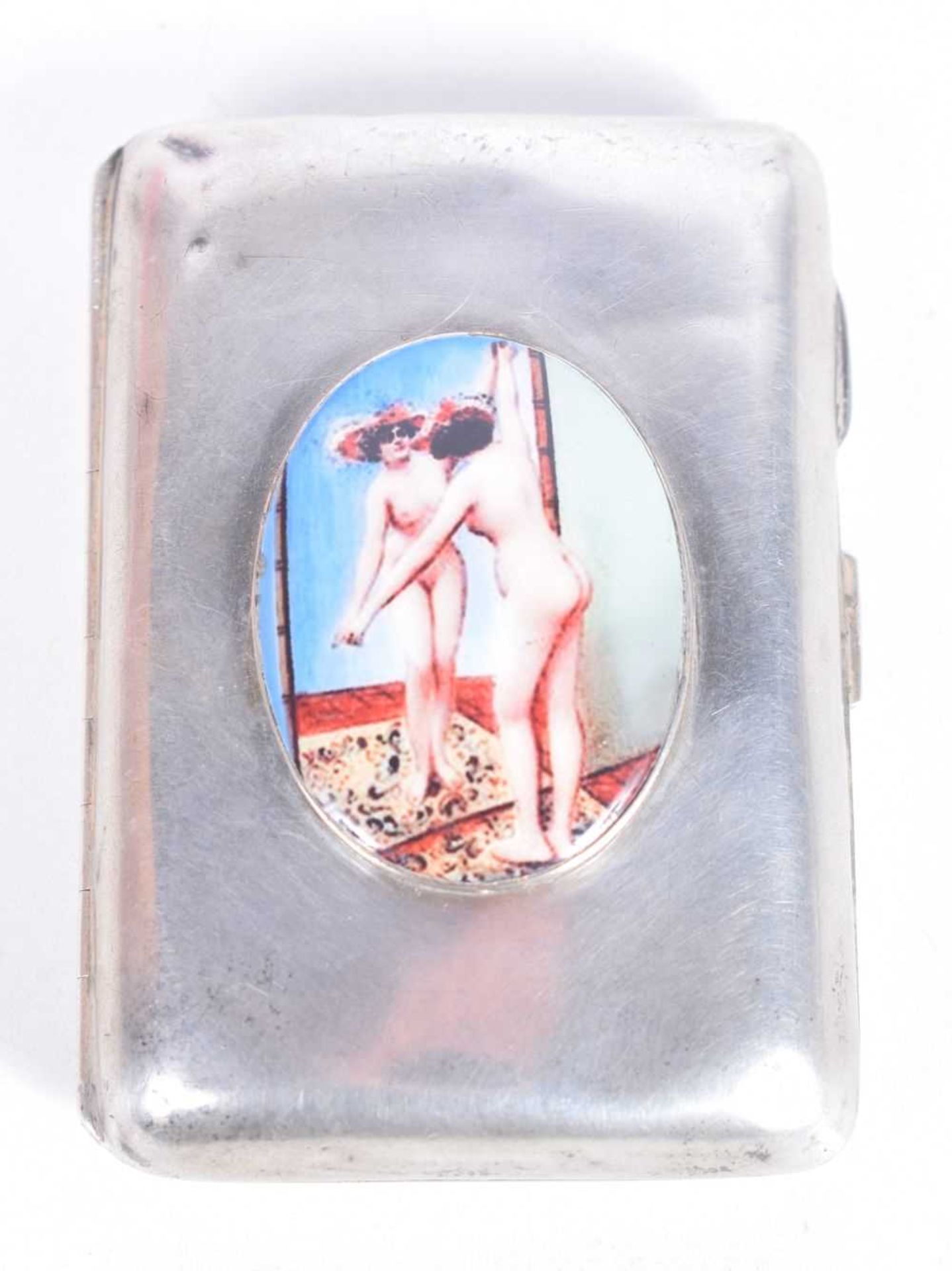 A SILVER CIGARETTE CASE WITH AN ENAMEL CABOCHON DEPICTING A NUDE POSING IN FRONT OF A MIRROR.
