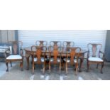 A FINE EARLY 20TH CENTURY QUEEN ANNE STYLE BURR WALNUT DINING TABLE extending with one leaf table