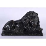 A LOVELY EARLY 19TH CENTURY REGENCY BRONZE MODEL OF A recumbent LION modelled upon a naturalistic