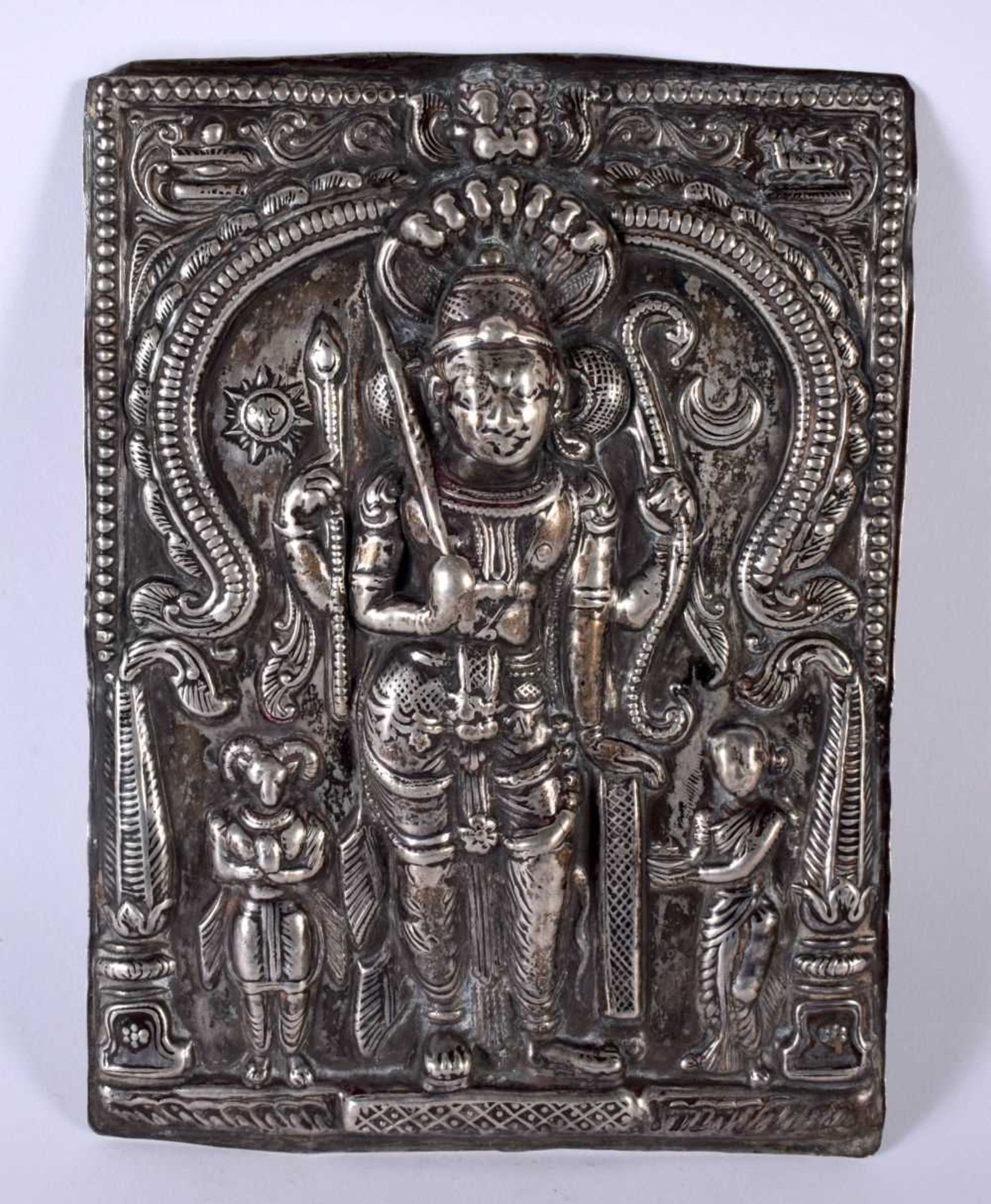 A silver repousse plaque of Shiva, South India, 19th century, of rectangular form, Shiva depicted in