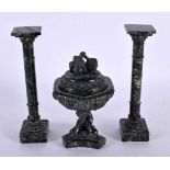 A 19TH CENTURY ITALIAN CARVED SERPENTINE GRAND TOUR GARNITURE comprising of pair of columns with