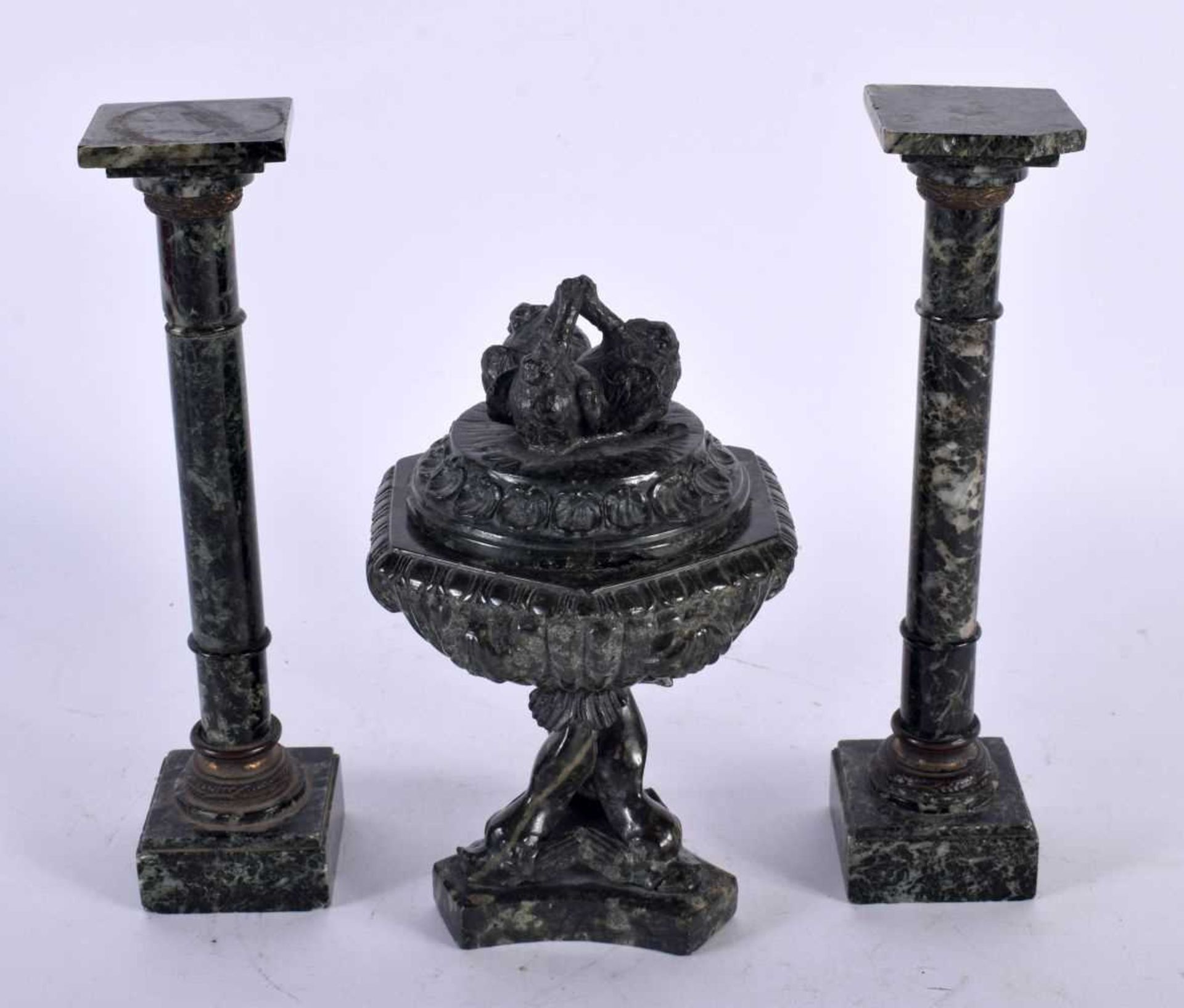 A 19TH CENTURY ITALIAN CARVED SERPENTINE GRAND TOUR GARNITURE comprising of pair of columns with