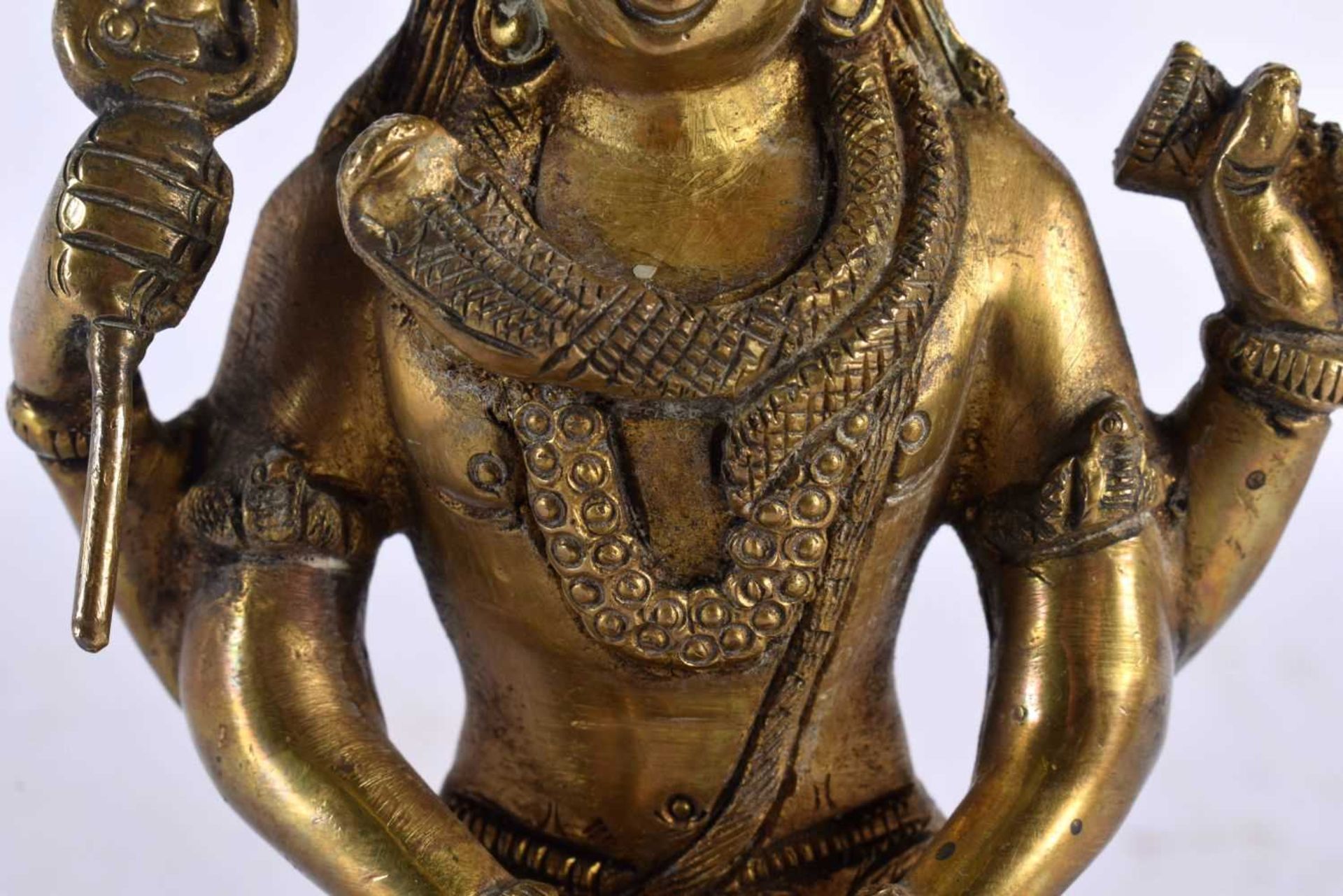 A 19TH CENTURY INDIAN BRONZE HINDU FIGURE OF SHIVA modelled seated on a lion skin with vasuki, - Image 3 of 8