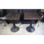 A pair of square topped wooden tables with metal pedestal and base 75 x 60 x 60 cm (2).