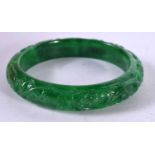 A CHINESE CARVED JADE BANGLE. 53 grams. 6 cm wide.