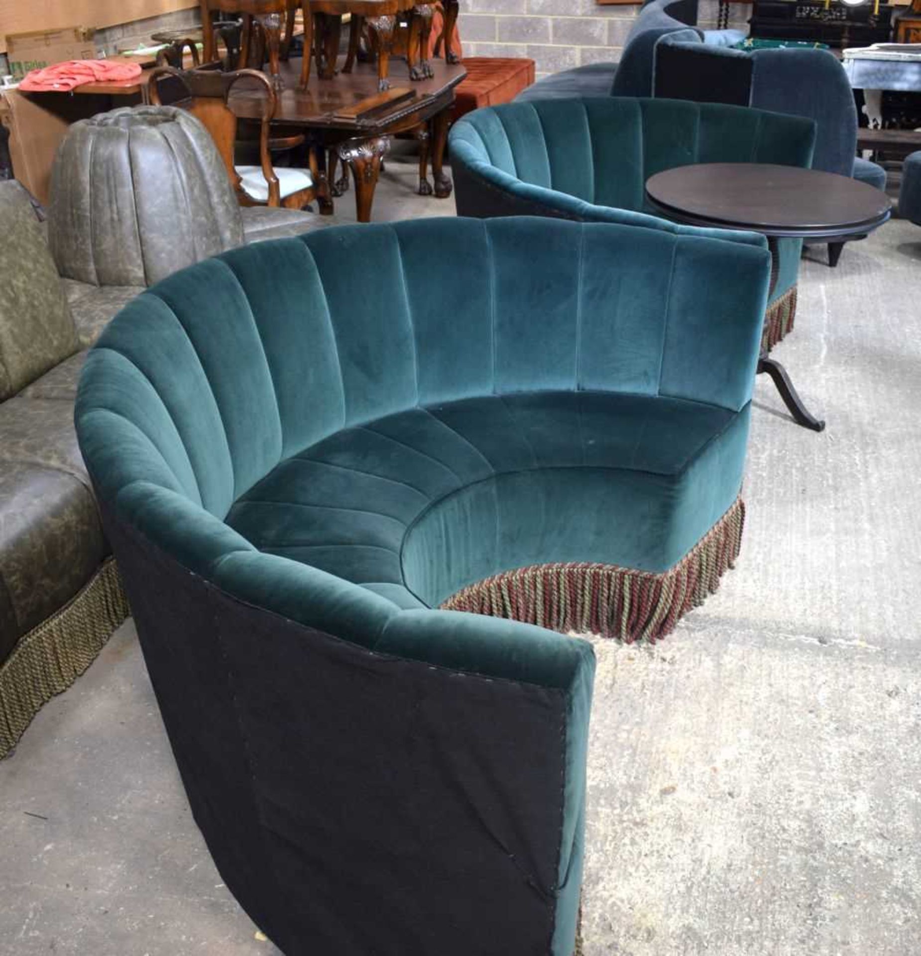 A pair of Semi Circular showroom fabric sofas together with a wooden round topped table 93 x 180 x