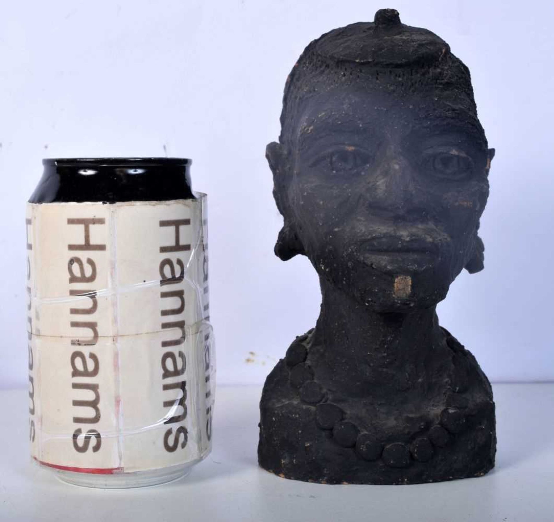 An African Tribal clay bust 17 cm.