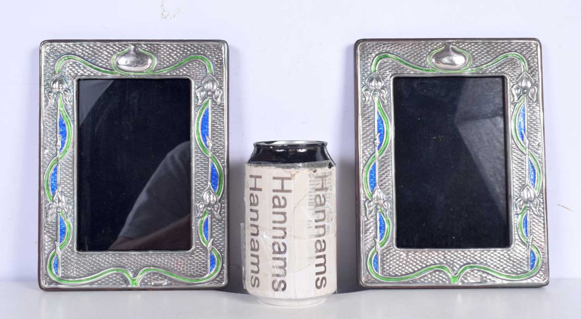 A pair of silver and enamelled picture frames 20 x 15cm.