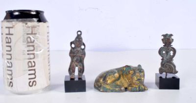 Two small Central Asian mounted bronze figures together with a recumbent gilded metal beast 3 x 8