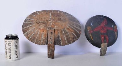 A carved wood feeding bowl together with another bowl carved with a figure 12 x 29 cm (2).