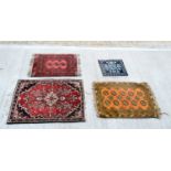 A collection of small rugs largest 99 x 71 cm. (4).