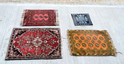 A collection of small rugs largest 99 x 71 cm. (4).