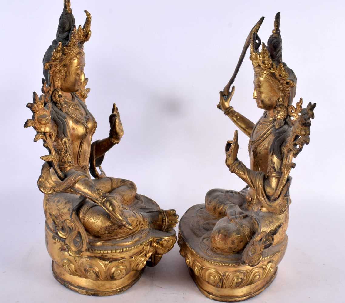 A LARGE PAIR OF 19TH CENTURY CHINESE TIBETAN GILT BRONZE FIGURES OF BUDDHAS Qing, modelled upon - Image 6 of 9