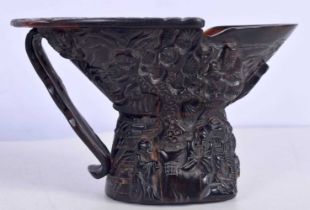 A Chinese horn Libation cup carved with figures 11cm.